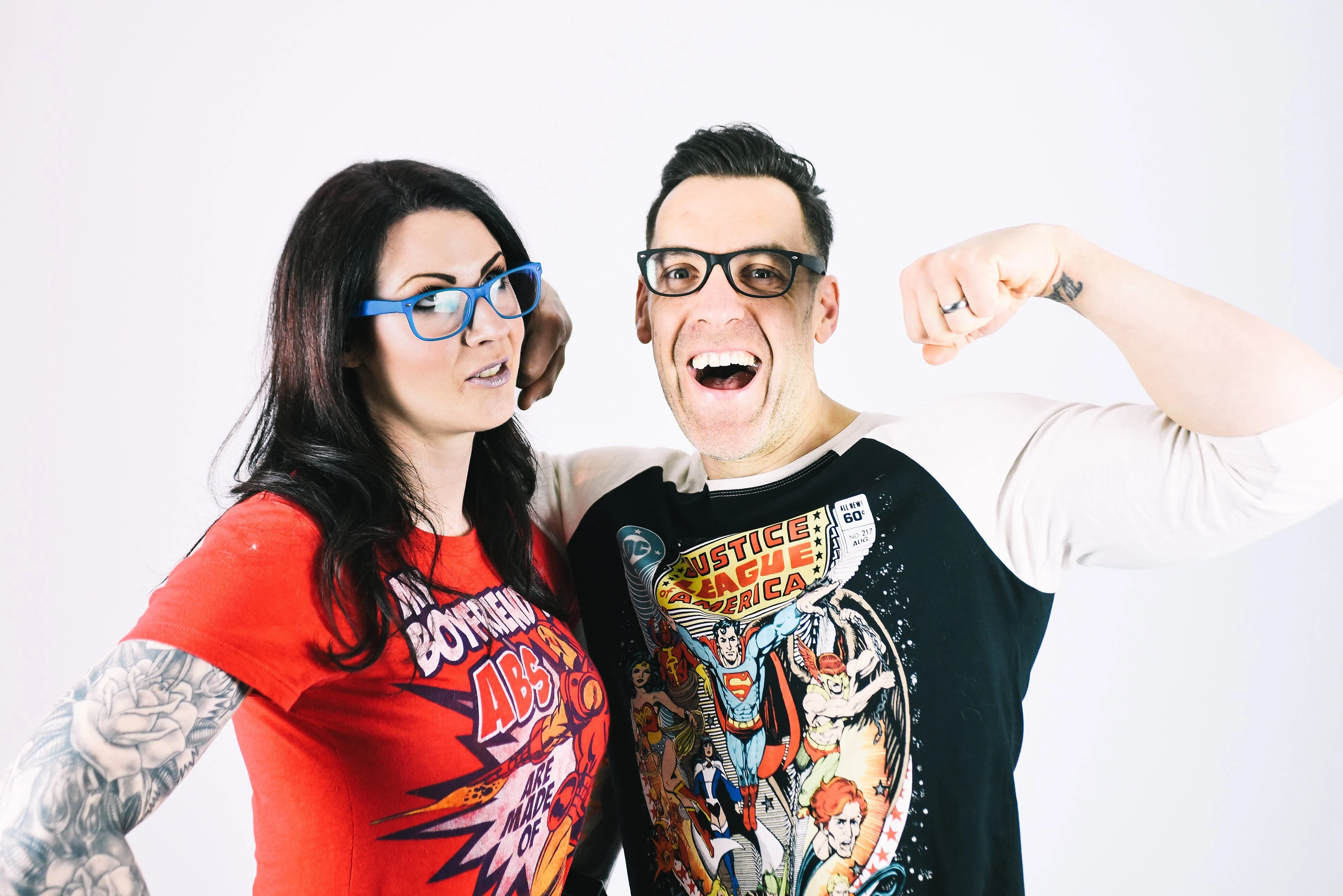 Loz and Baz, the Rock Solid Health coaches, laughing as Baz flexes a bicep